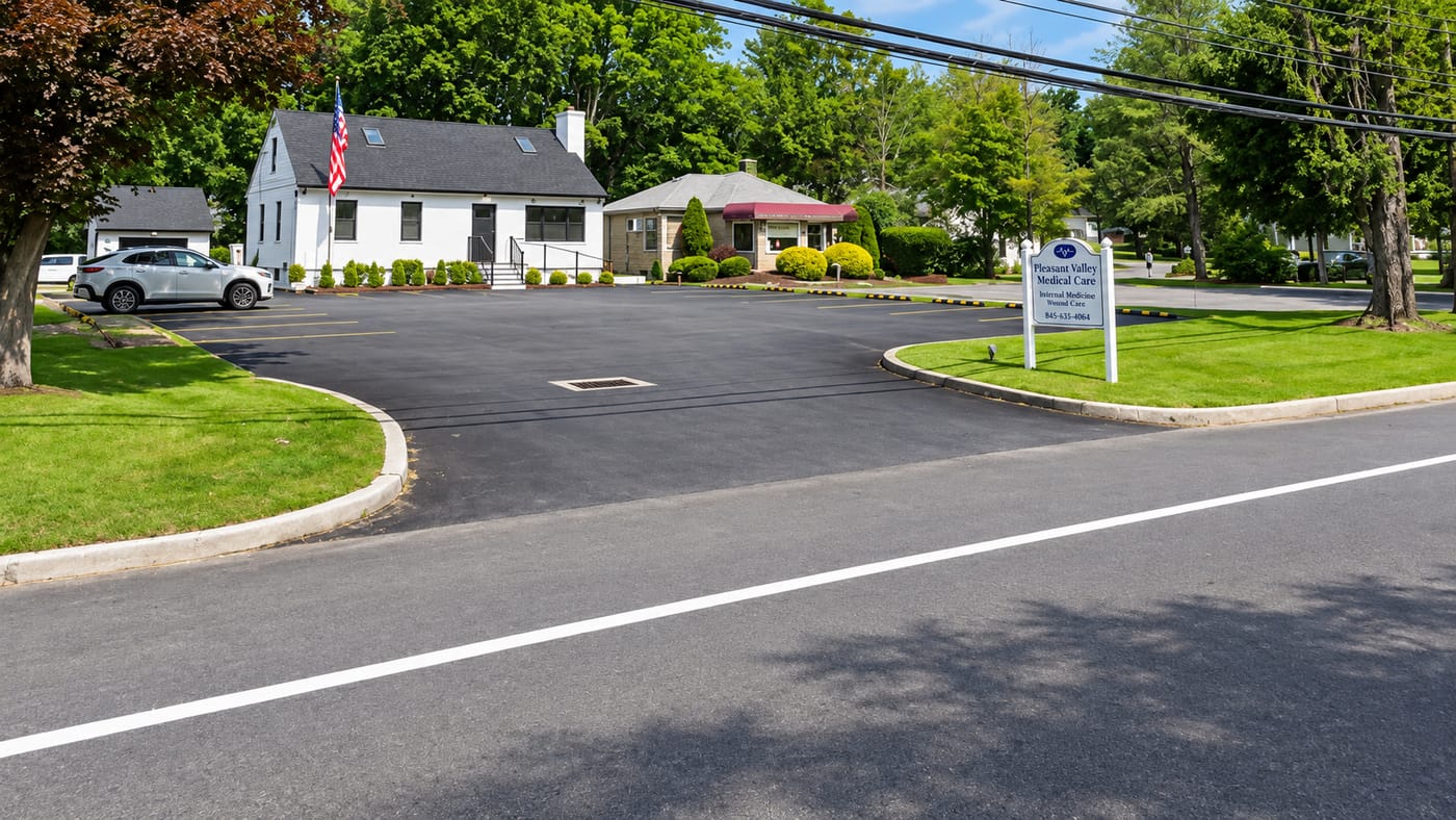 The Pleasant Valley Medical Care office, a white building with a parking lot on Route 44 in Pleasant Valley, New York